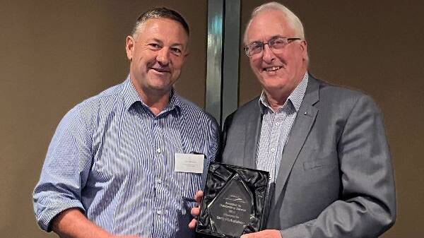 ADIC chair Ben Bennett presents the 2023 Pat Rowley Outstanding Service Award to Terry Richardson. Picture supplied