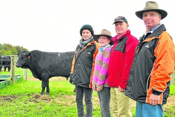HIGH NOTE: Pictured with the $8000 top-price bull at the sale are Coolana principals Anna and Mark Gubbins (right), Chatsworth, buyer Steve McLeod and his daughter Holly, Macarthur, Vic.